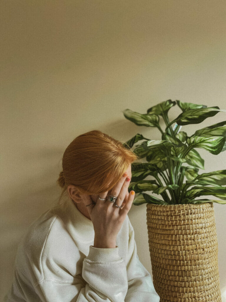 woman with head on hands