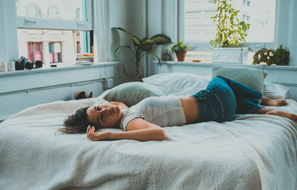 woman lying on bed