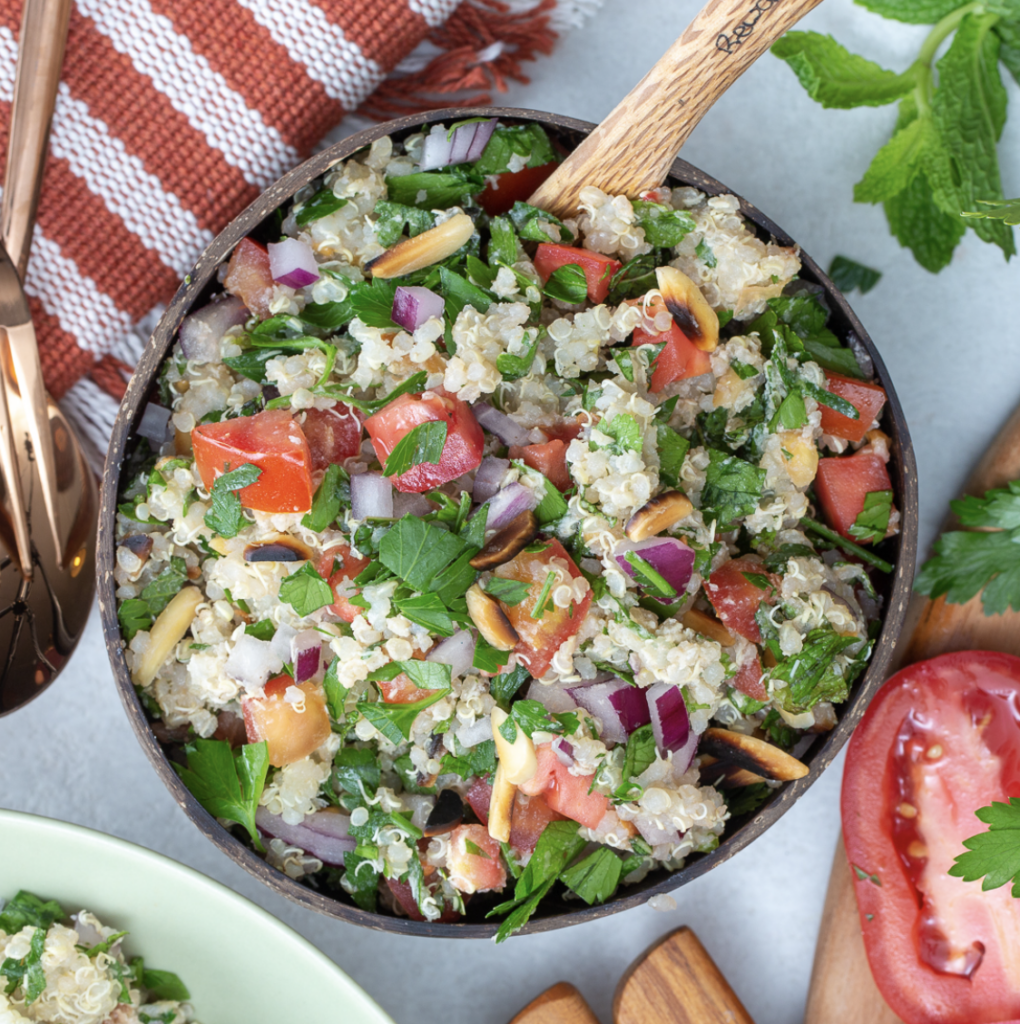 A bowl of quinoa salad full of nutrient rich foods for mental health