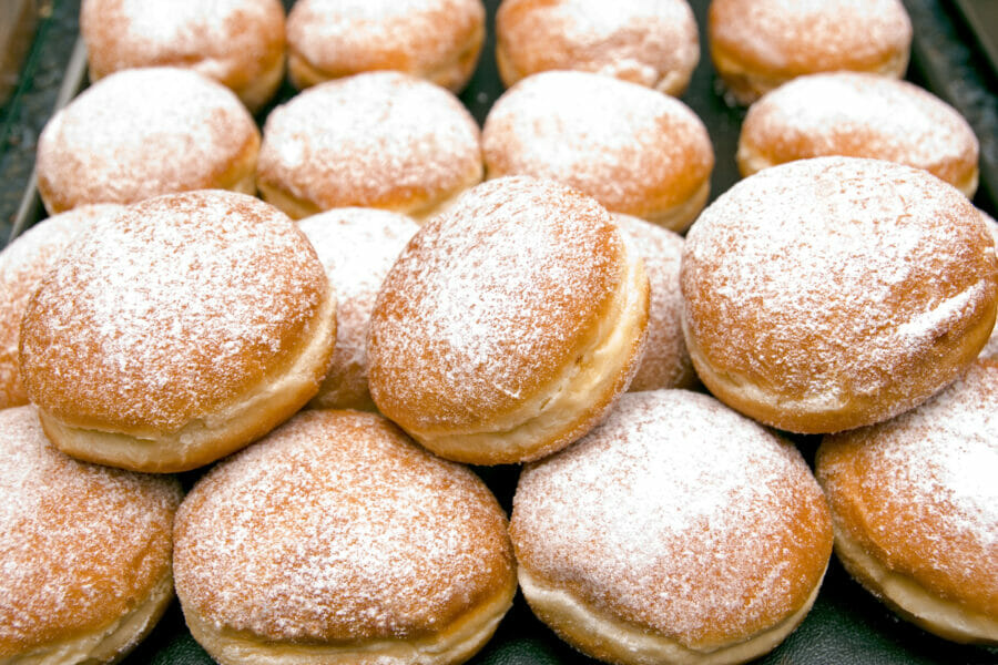 Image of jam-filled powered doughnuts to illustrate that sugar is not helpful for menstrual cramps.