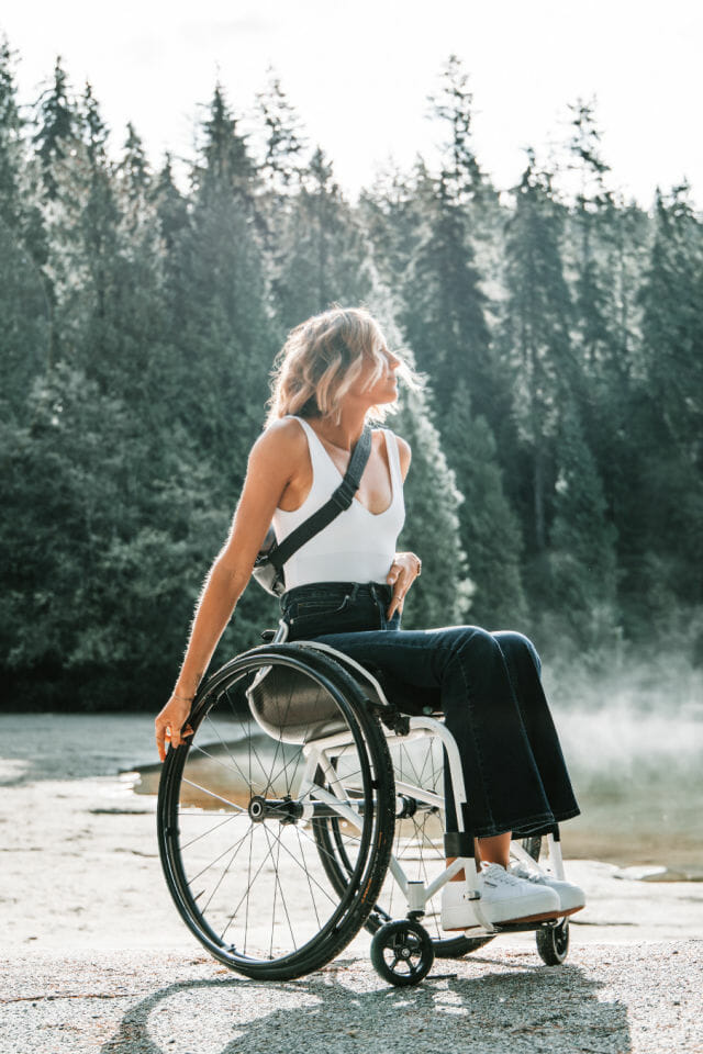 Woman in a wheelchair in the forest