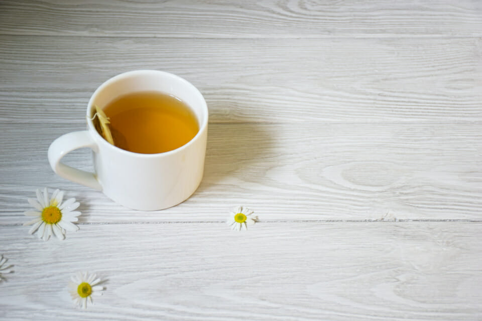 Image of a cup of chamomile tea which can help with menstrual cramps