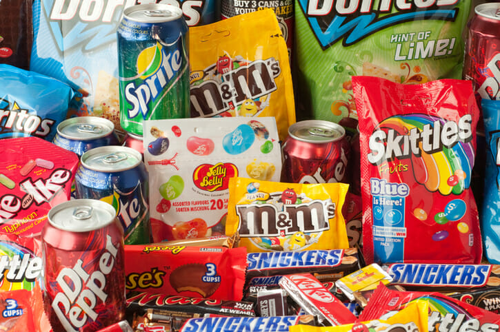 Image of sugary drinks and sweets which when consumed in excess can cause issues with mental health