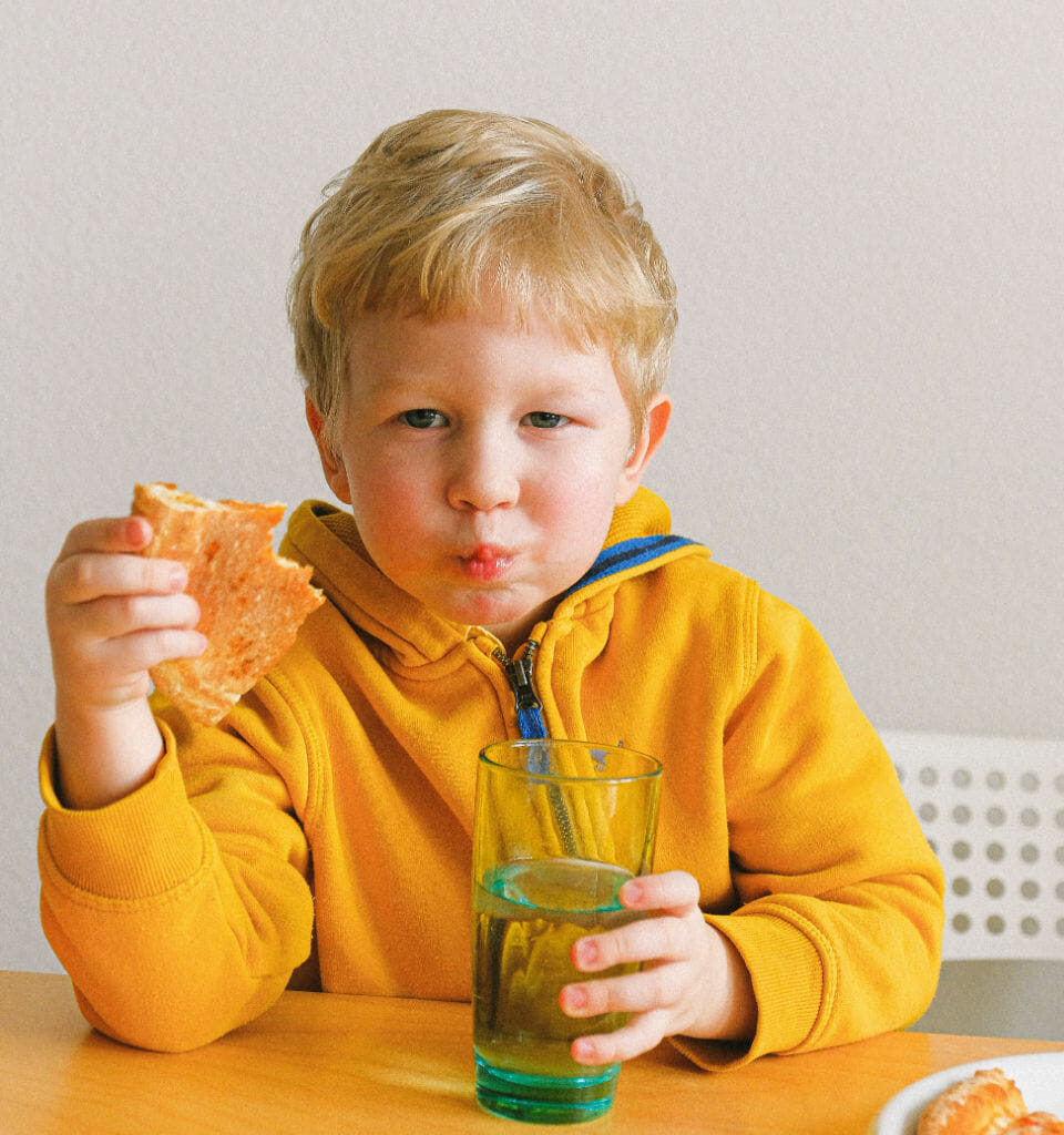 Image of a child eating pizza, which could impact children with ADHD