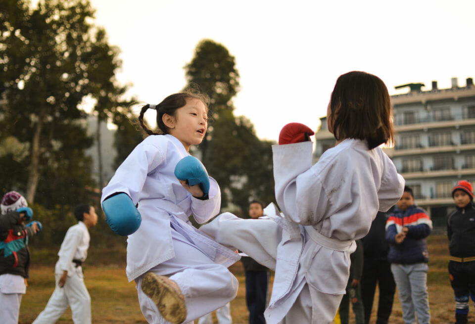 Young girls doing boxing as a way to excell excess energy due to both being a child with ADHD