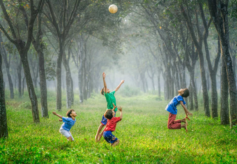 Kids play outside in nature which is a perfect way to help your child with ADHD