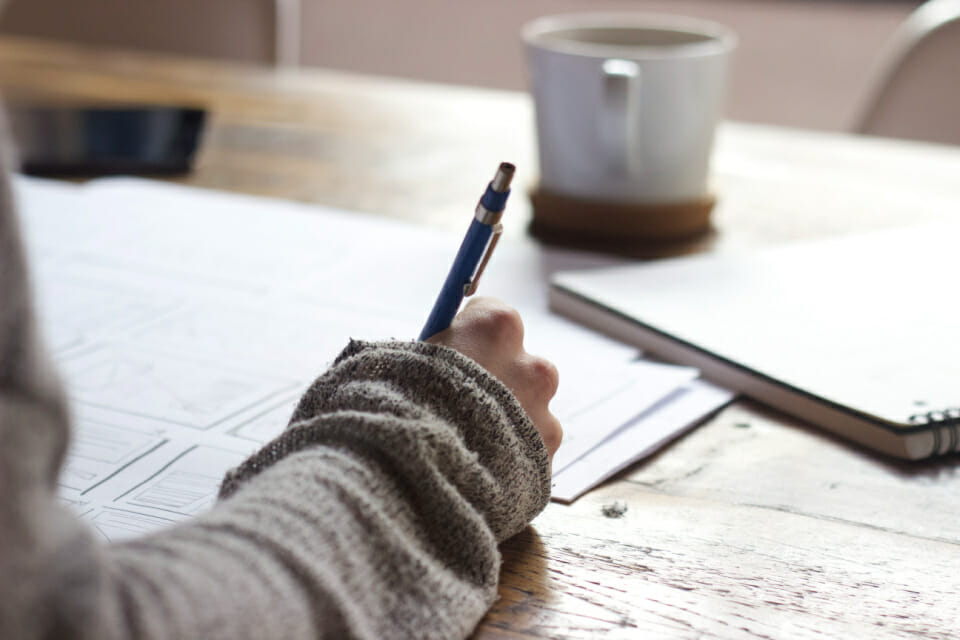 Image of a hand journaling